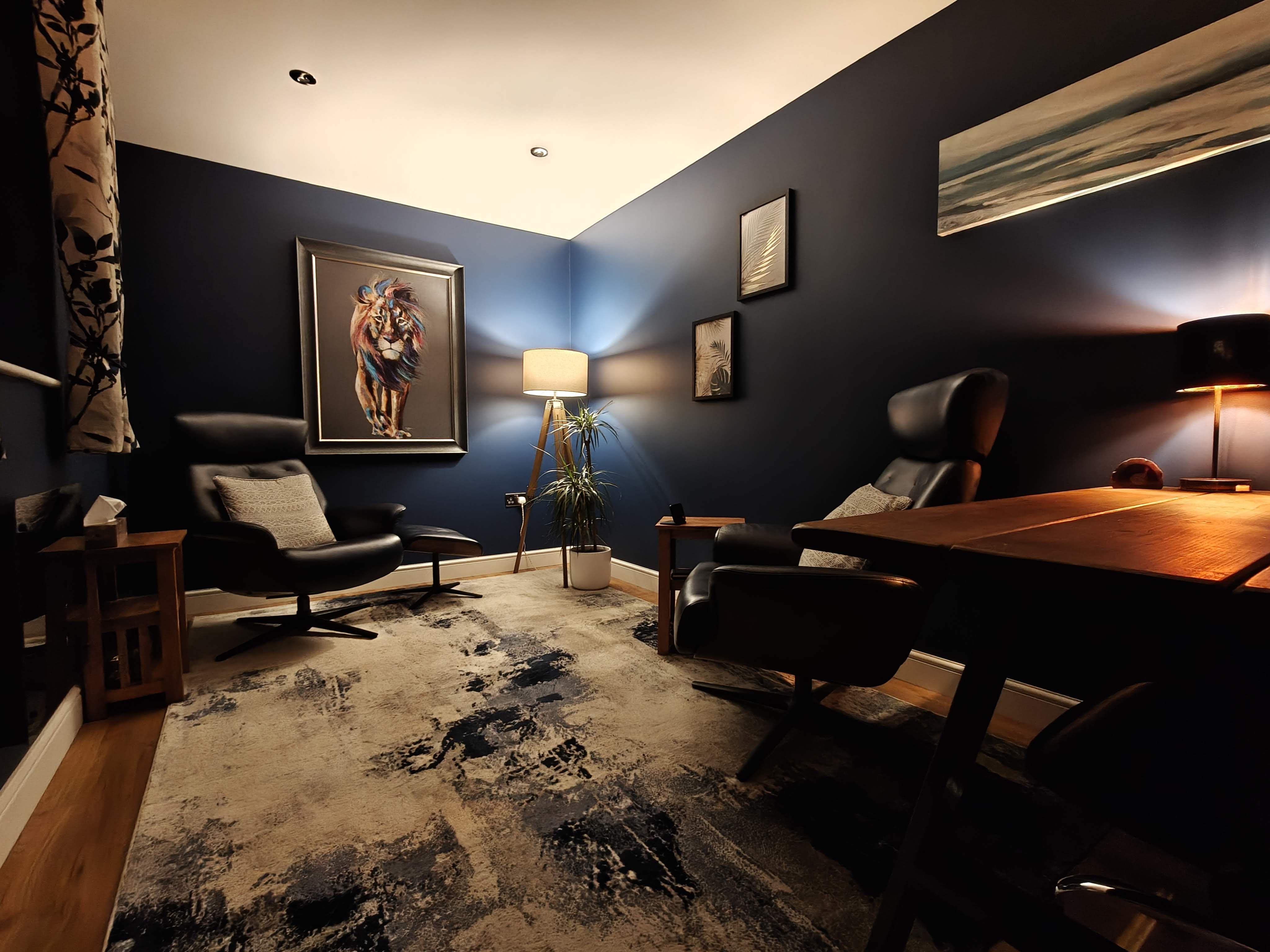 The therapy room in the evening, with warm lamp light